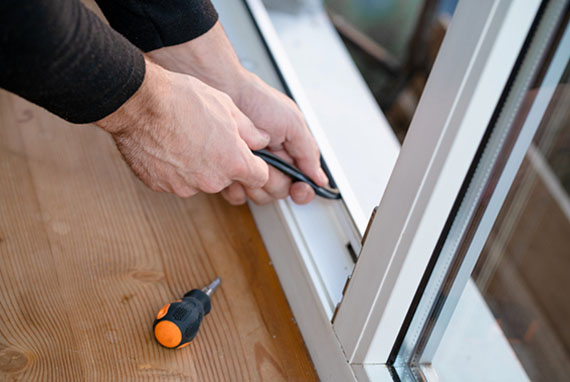 Repairman repairing window